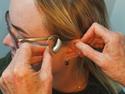 Person having hearing aid fitted