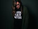 A person wearing a mental health matters t shirt
