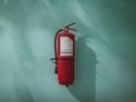 Fire extinguisher attached to wall