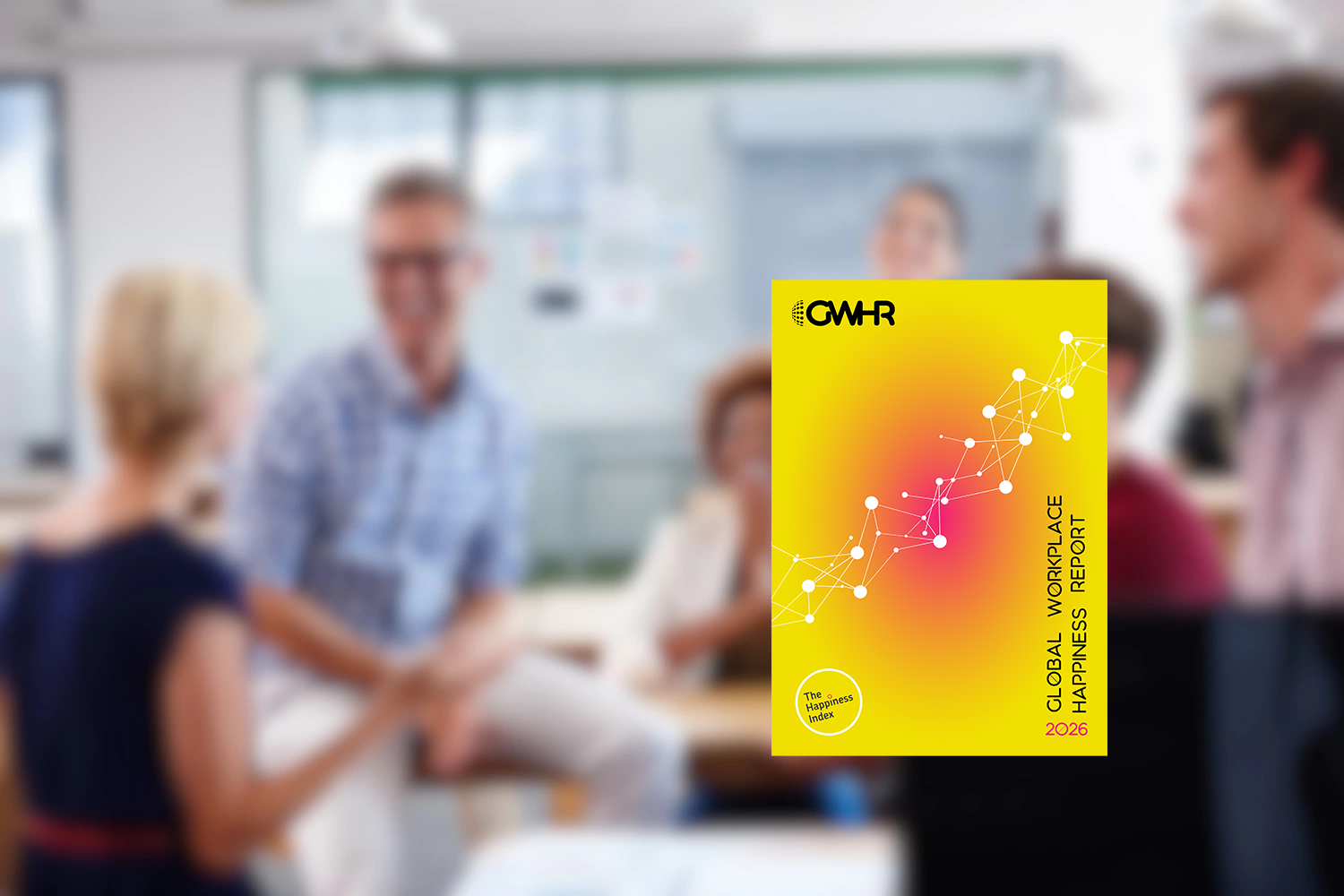 A blurred background showing a diverse group of people engaged in a positive, collaborative office meeting. Centered in the foreground is a sharp, clear image of the Global Workplace Happiness Report 2026 cover, featuring a vibrant yellow and pink gradient and a white geometric network graphic.